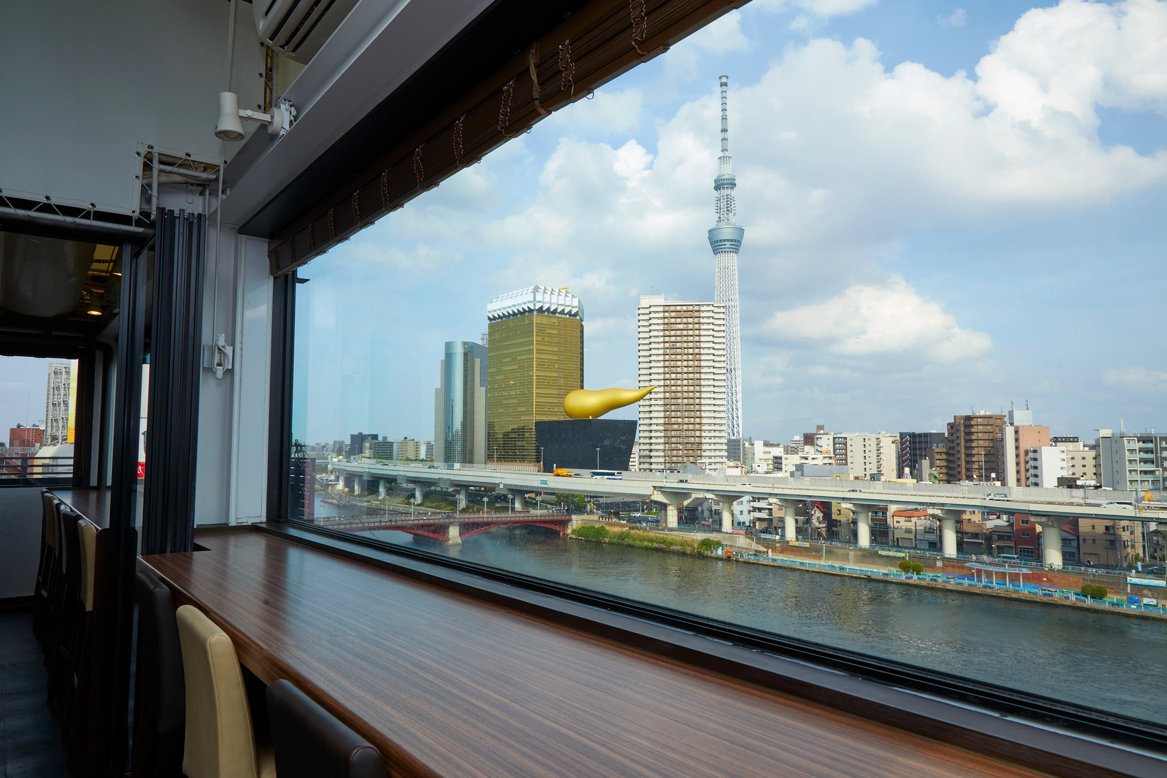Sky Tororo Buffet at Asakusa Mugitoro rooftop Lounge Vista with views of the Sumida River and Tokyo Skytree